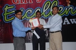  Ratan Kumar getting the prize for securing first rank in BBA sixth semester.