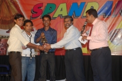 The student recieving the prize from our chief guest.